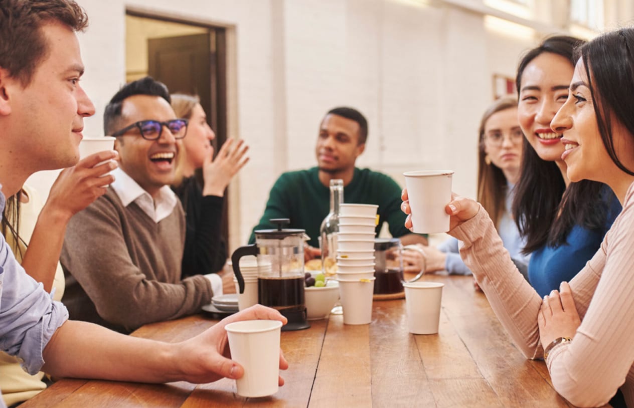 A small group talking over coffee at an Alpha course session.