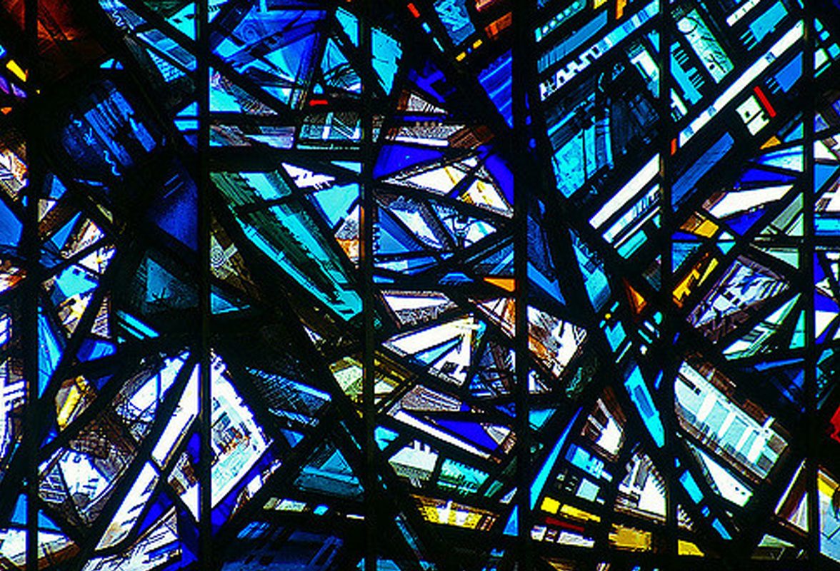 A panel of stained glass in the Minster, lit by the sun.